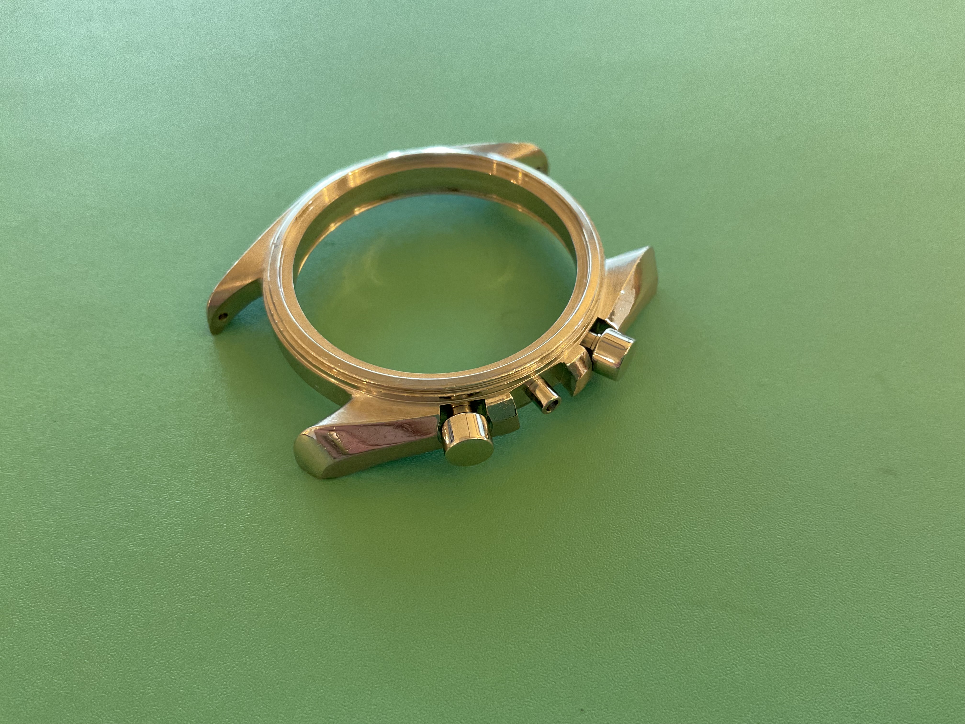 The refinished case with its new chronograph pushers fitted.