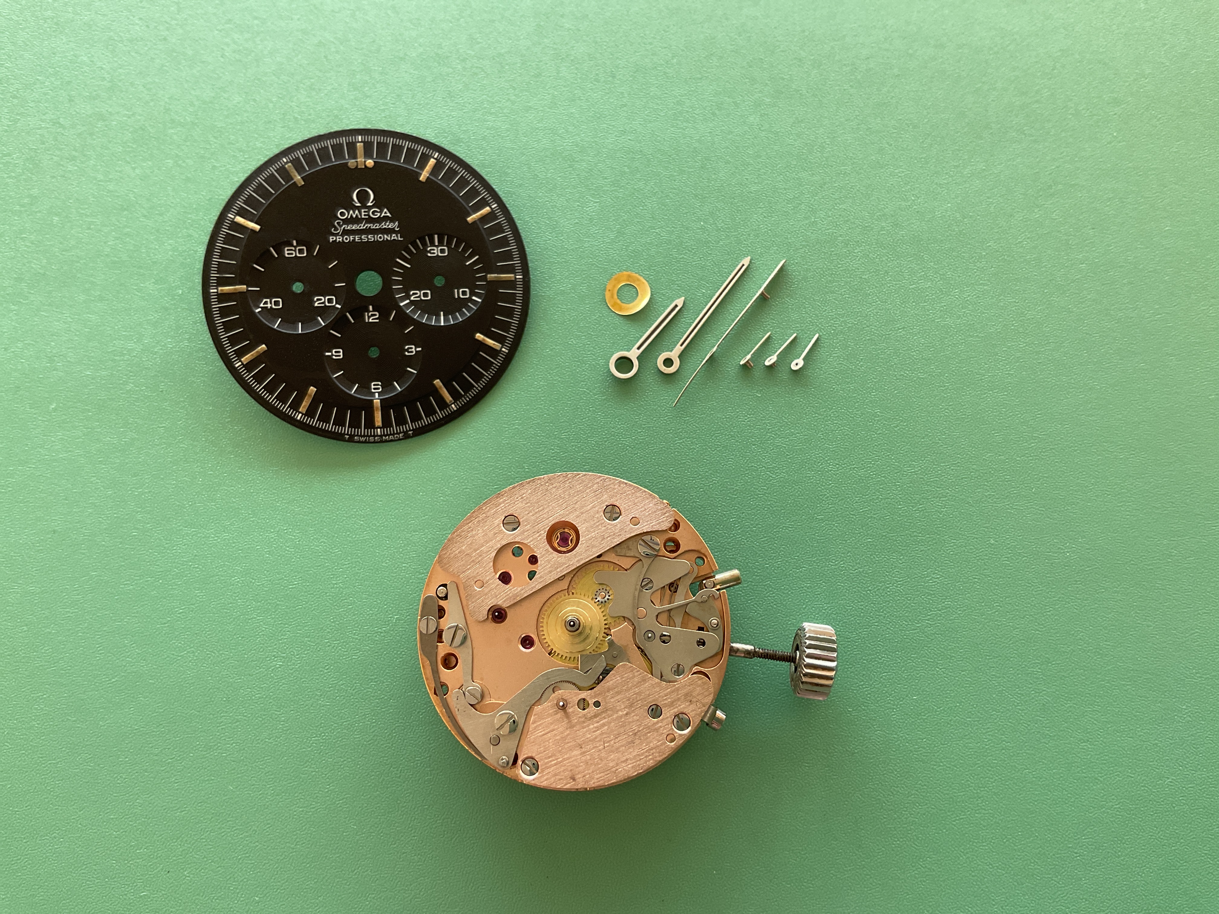 The dial, hands, crown, and movement separated during teardown.