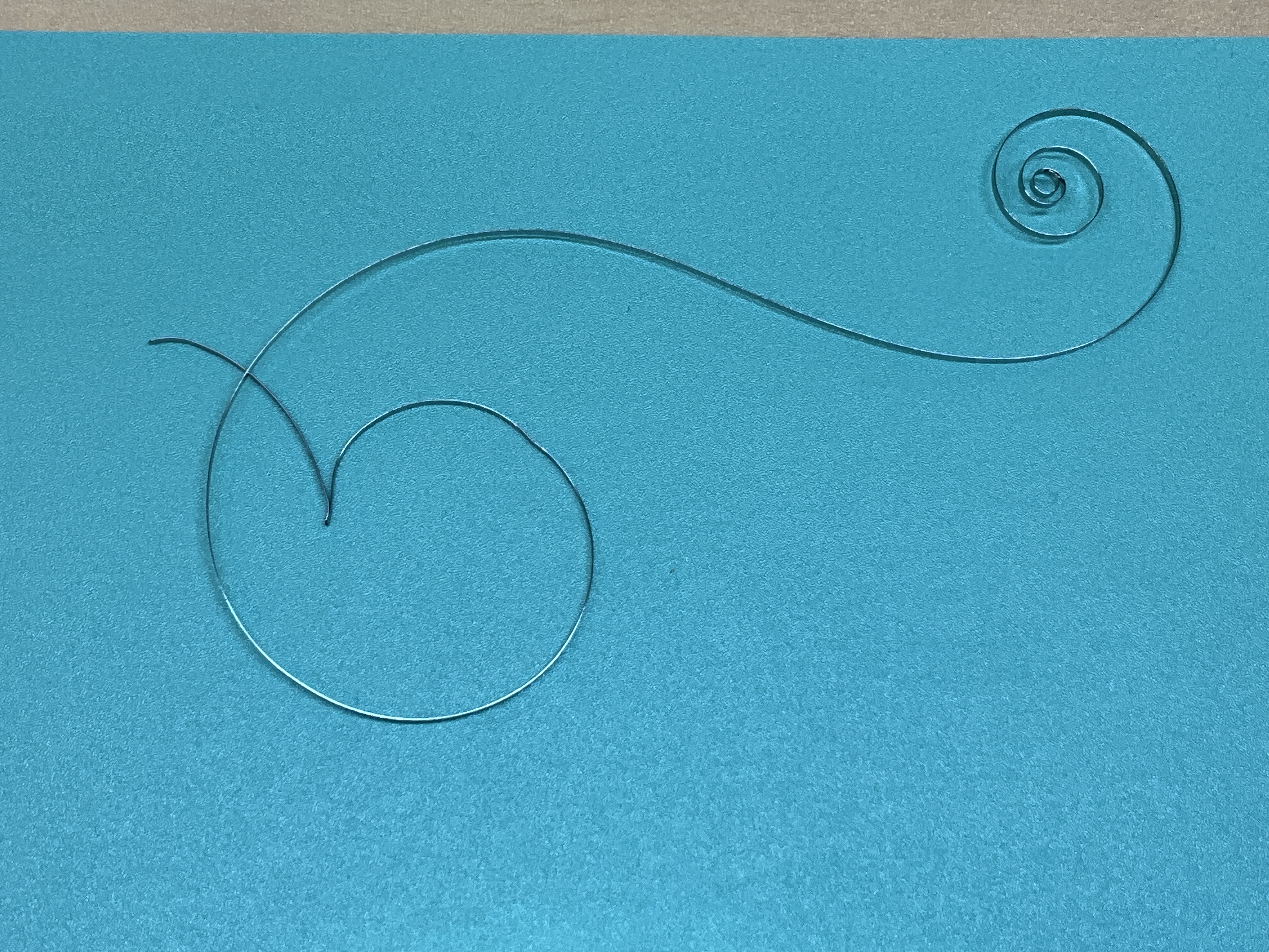 The original mainspring, distorted and unfit to reuse.