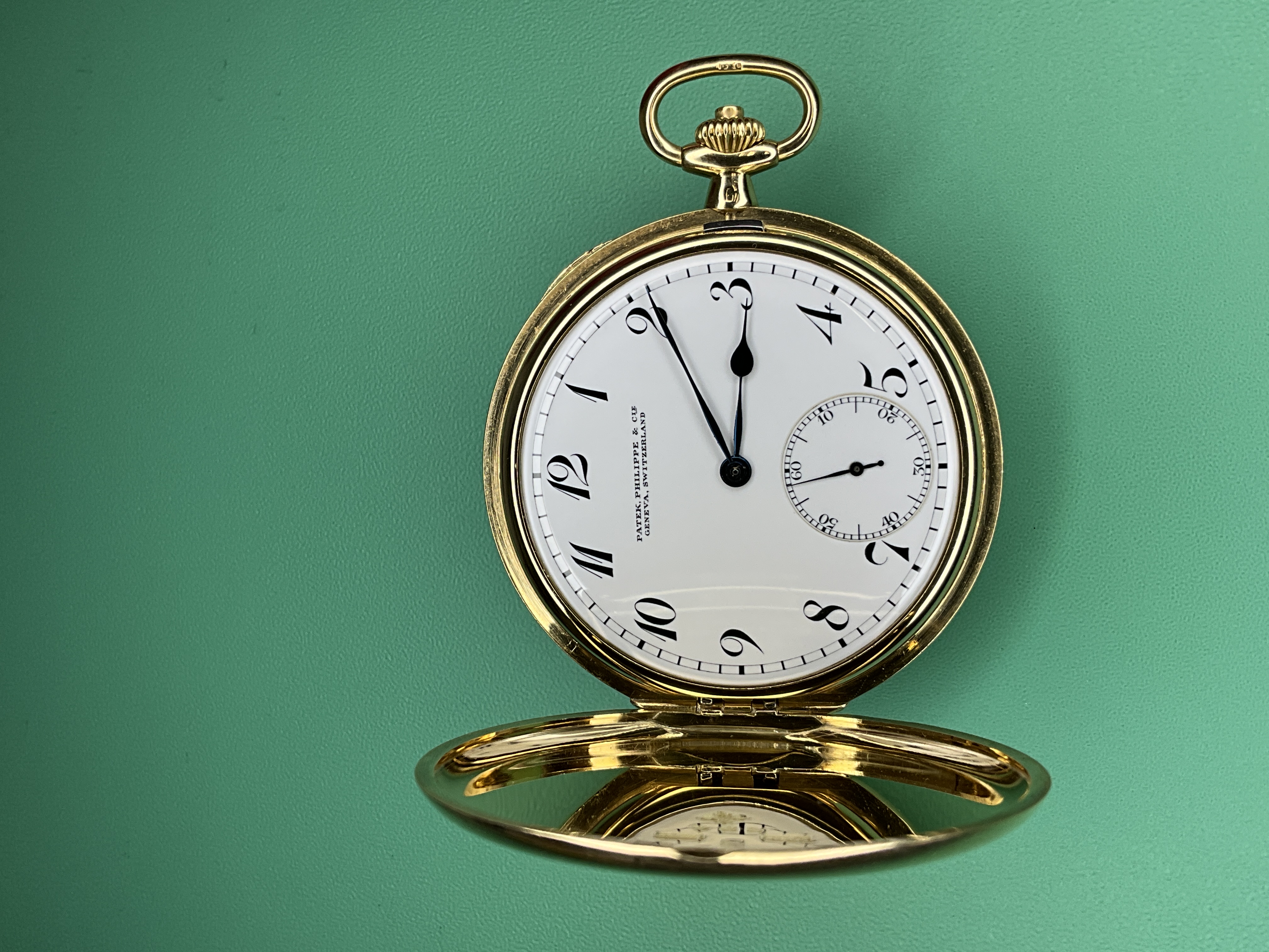 The finished Patek Philippe hunter, dial restored and case complete.