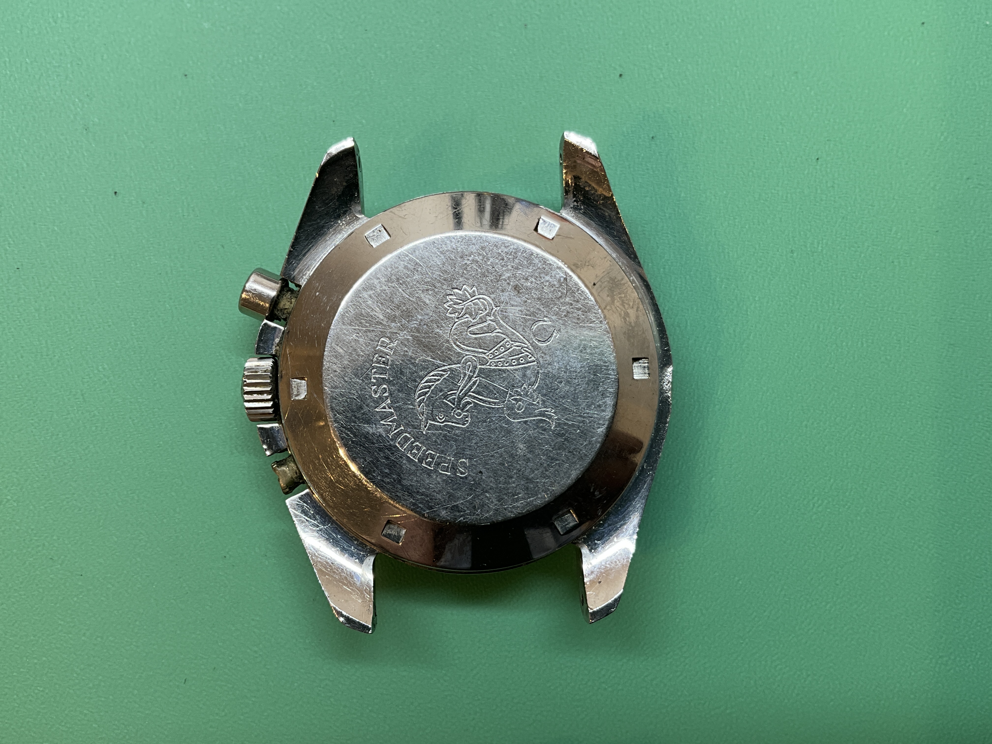 As received — the worn caseback with its Speedmaster seahorse engraving.